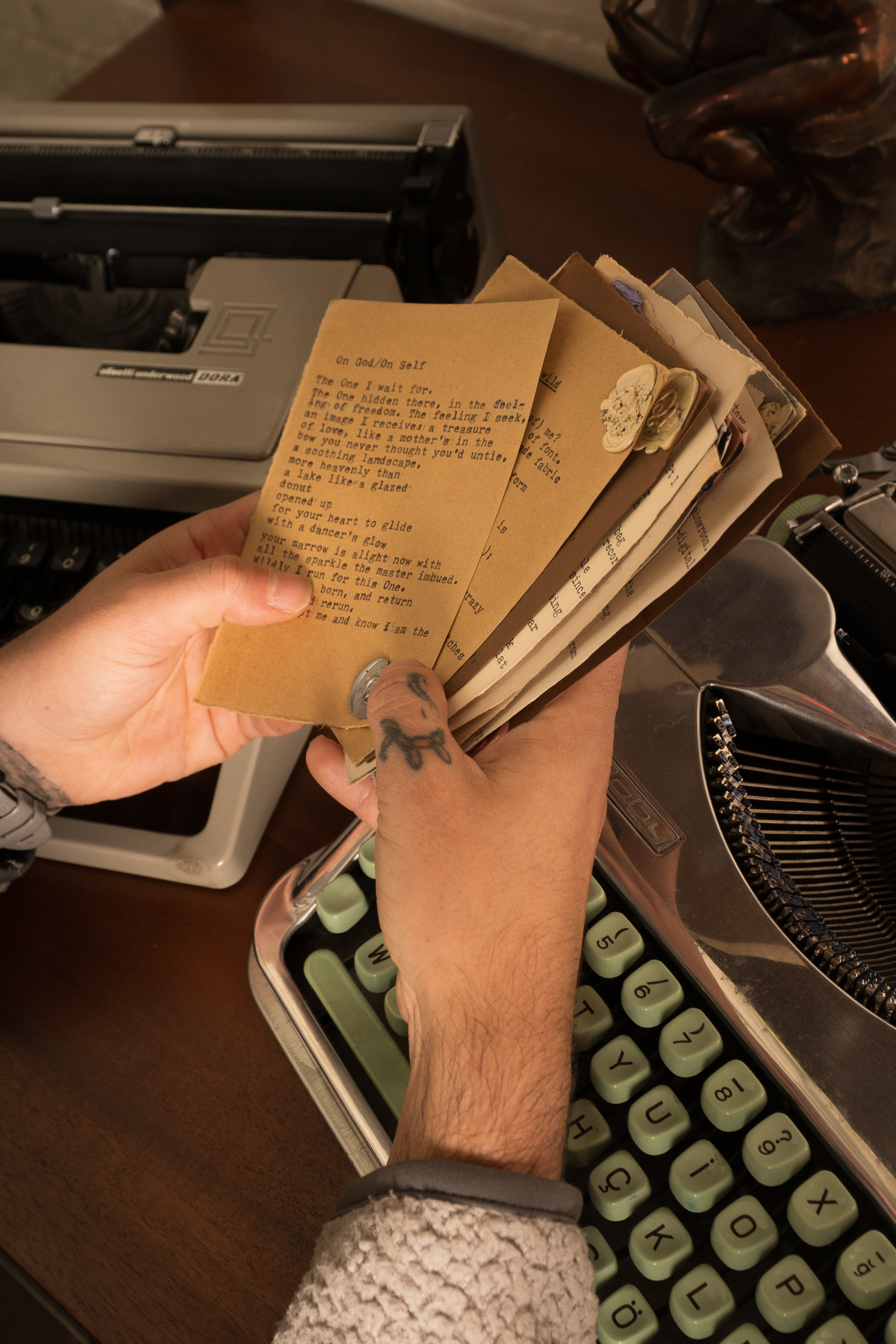Hand holding typewritten poems